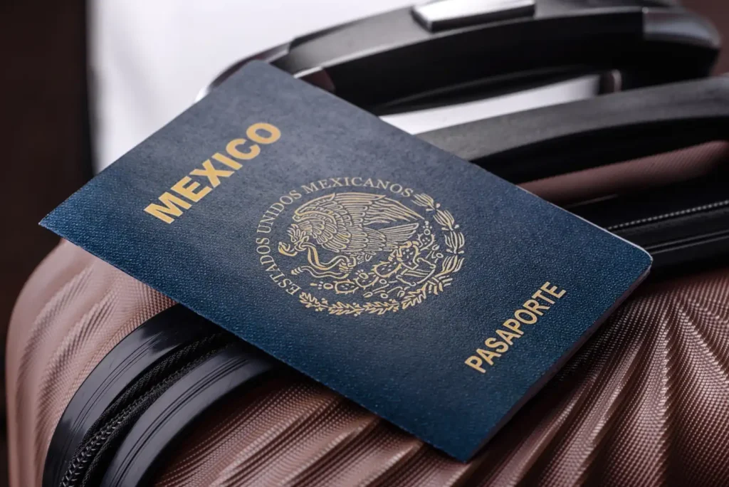 Mexican passport on luggage, representing international travel documents, dual citizenship, immigration services, and US-Mexico visa applications.