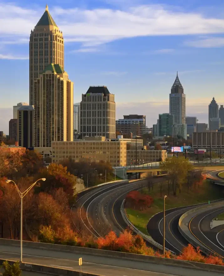Downtown Atlanta Georgia skyline and highway infrastructure, representing regional business hubs, urban architecture, and Pacific Northwest to Southeast location banners.